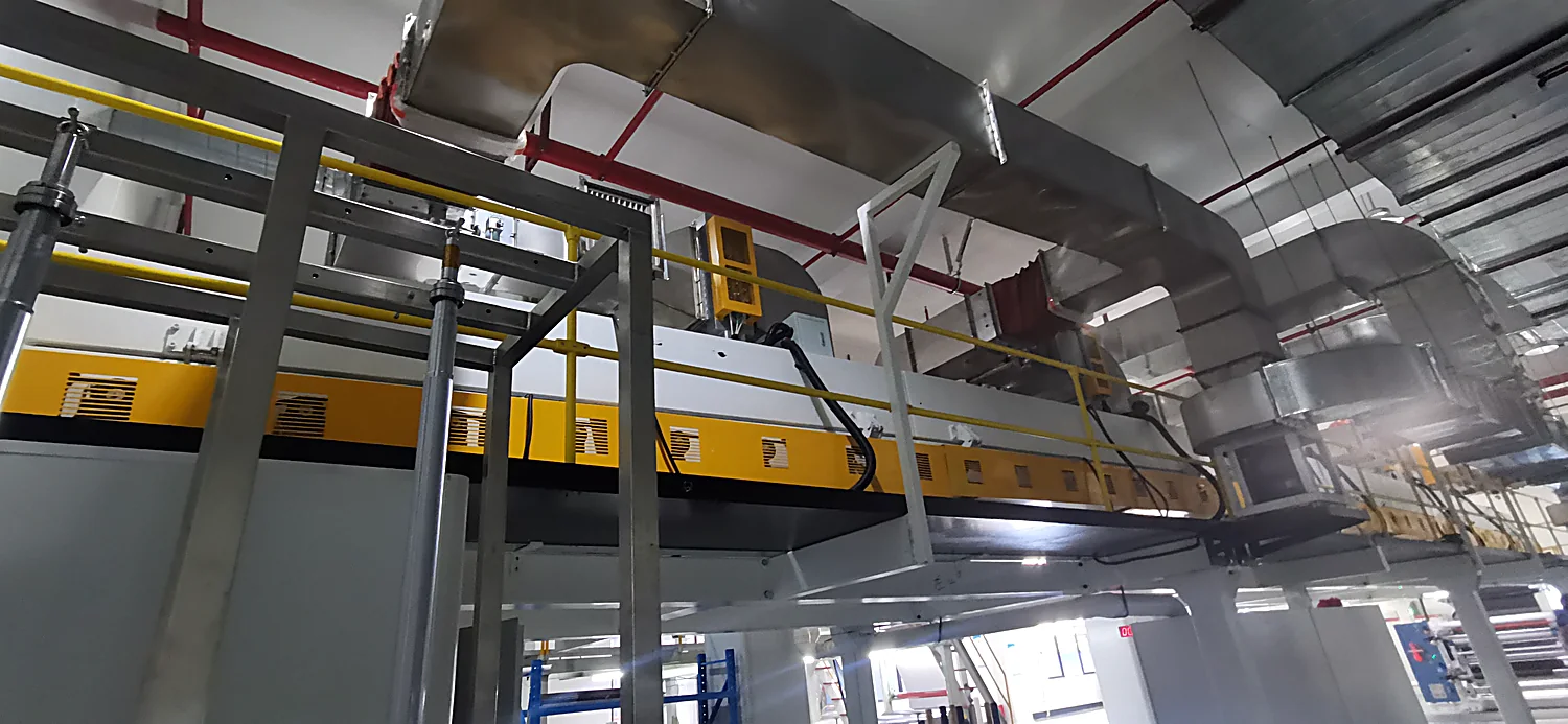 Roll-to-roll coating machine running a water-based conductive coating at the Shengtong plant